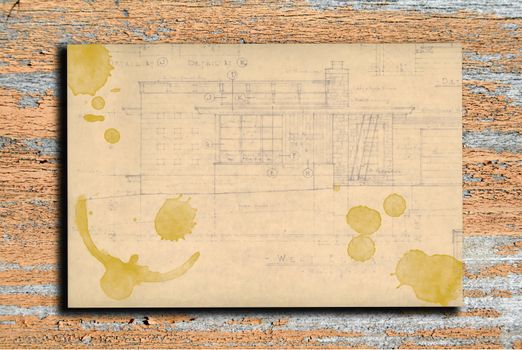 Vintage paper with coffee stains on wooden background