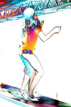 go-go girl dancing on a bar of a public festival