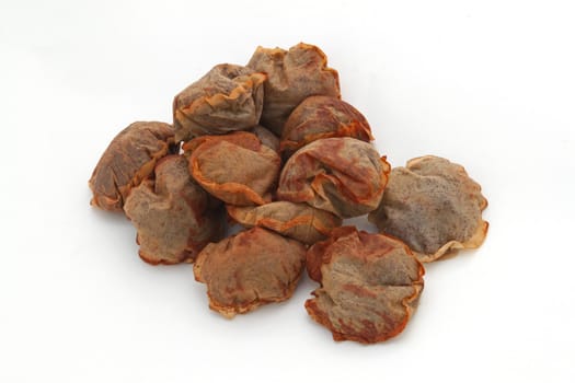 Used tea bags against a plain white background.