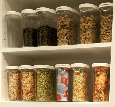 cupboard with food stock as thee and candy