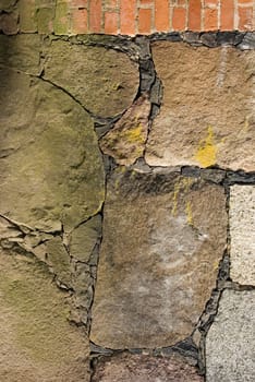 Historic building walls of brick and stone fragment