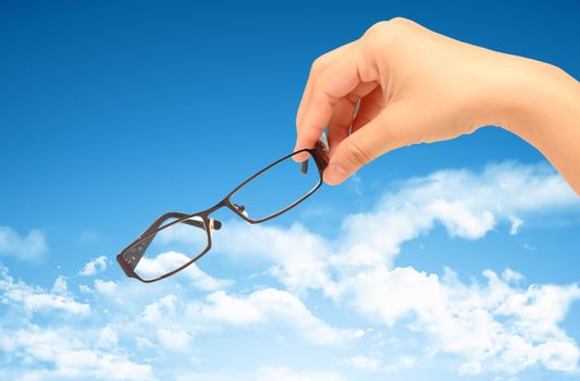 Glasses against blue sky