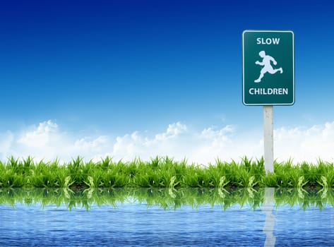 sign on the grass with the bright sky
