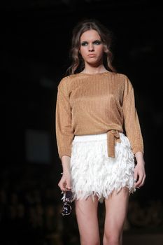 ZAGREB, CROATIA - MARCH 22: Fashion model wears clothes made by Anamarija Asanovic on "CRO A PORTER" show on March 22, 2012 in Zagreb, Croatia.