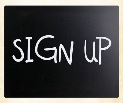 "Sign up" handwritten with white chalk on a blackboard