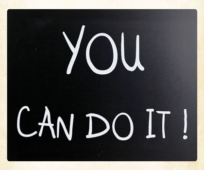 "You can do it" handwritten with white chalk on a blackboard