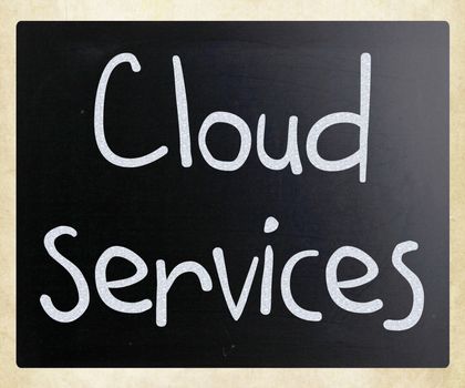 "Cloud services" handwritten with white chalk on a blackboard
