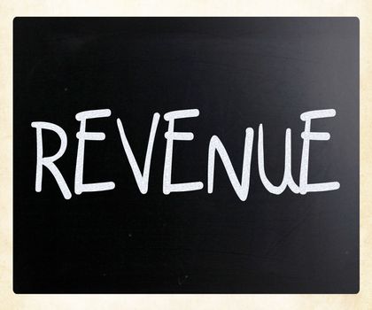 "Revenue" handwritten with white chalk on a blackboard