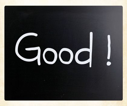 "Good" handwritten with white chalk on a blackboard