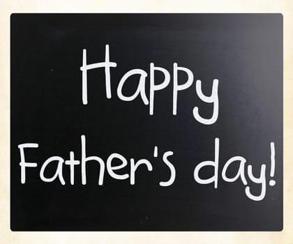 "Happy father's day" handwritten with white chalk on a blackboard