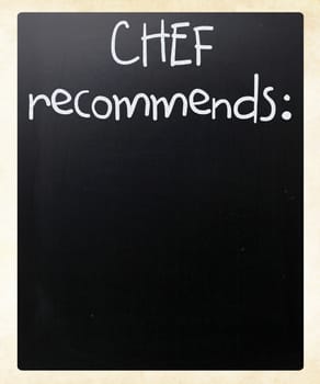 "Chef recommends" handwritten with white chalk on a blackboard