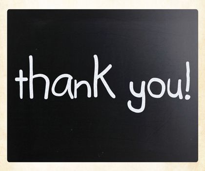 "Thank you" handwritten with white chalk on a blackboard