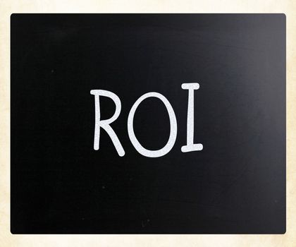 The word "ROI" handwritten with white chalk on a blackboard