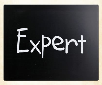 The word "Expert" handwritten with white chalk on a blackboard
