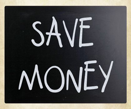 "Save money" handwritten with white chalk on a blackboard