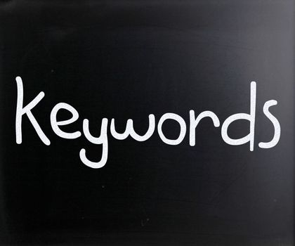 The word "Keywords" handwritten with white chalk on a blackboard