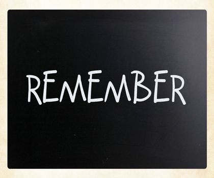 "Remember" handwritten with white chalk on a blackboard
