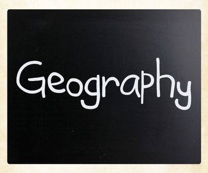 "Geography" handwritten with white chalk on a blackboard