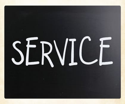 "Service" handwritten with white chalk on a blackboard