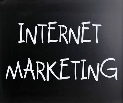 "Internet marketing" handwritten with white chalk on a blackboard