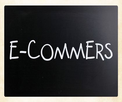 The word "E-commers" handwritten with white chalk on a blackboard