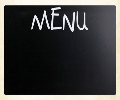 The word "Menu" handwritten with white chalk on a blackboard