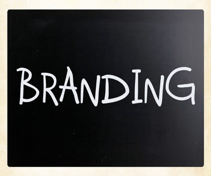"Branding" handwritten with white chalk on a blackboard