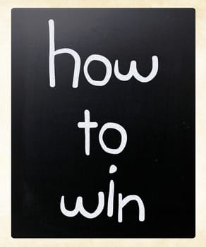 "How to win" handwritten with white chalk on a blackboard