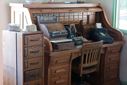 antique roll top desk with typewriter