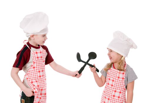 Two children dressed in chef isolated on the white background