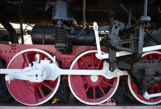 old steam locomotive wheel and rods right side
