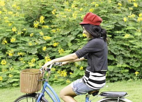 Attractive young woman cycling and having fun 