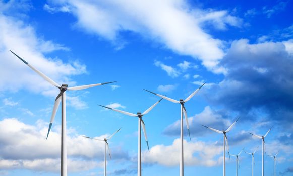 Windmill on cloudy sky