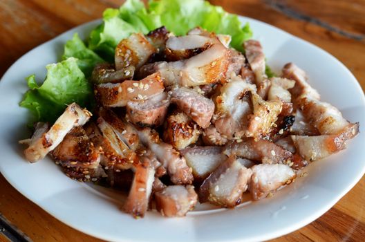 a delicious sliced grilled pork  served with vegetables