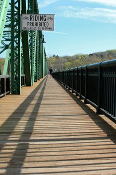A Wooden bridge walkway with blue sky