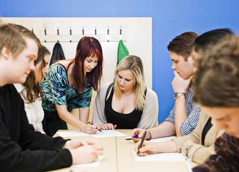 Teacher and young Adult students in the classroom