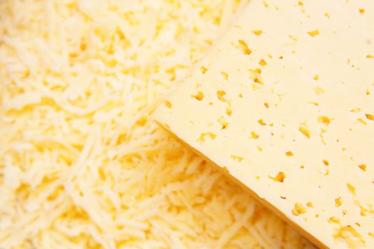 Cheese closeup and its shavings in plate