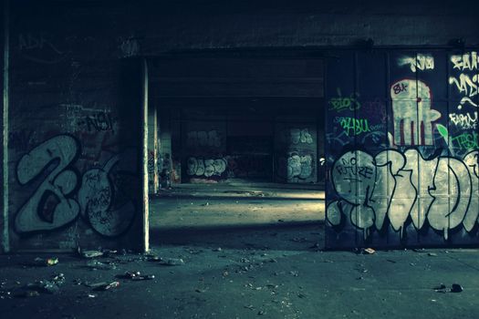 Abandoned building in a street in Berlin, where the younger generation spend their time leaving behind a graphic art of.