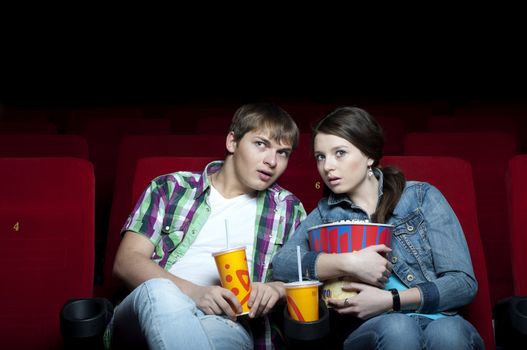 couple in a movie theater, watching a movie