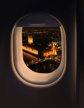 Approaching destination London UK destination, jet plane window night sky view