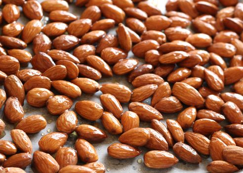 Close up of the whole almond nuts which are fried for background