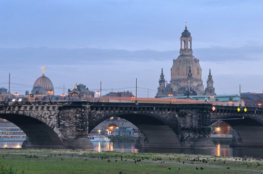 Dresden: view of the Frauenkirche and Augustus bridge from the other side of Elbe river