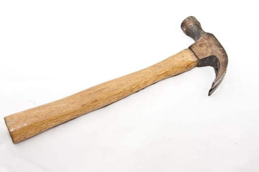 A rusty claw hammer over a white background