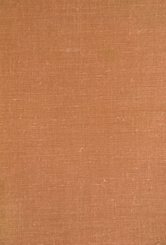 background of material covered old brown book paper cover.