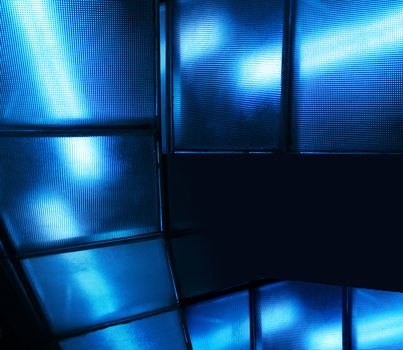 Blue light effect through modern textured glass panels background