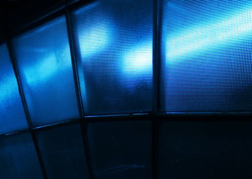 Blue light effect through textured glass panels wall