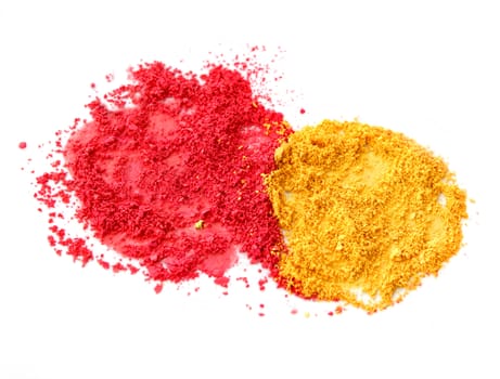 Red and yellow color powder dust isolated on white background