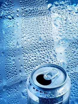 Cool aluminium tin drink can opened on blue drops background