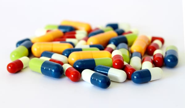 Colorful medical drugs pills vitamins capsules closeup