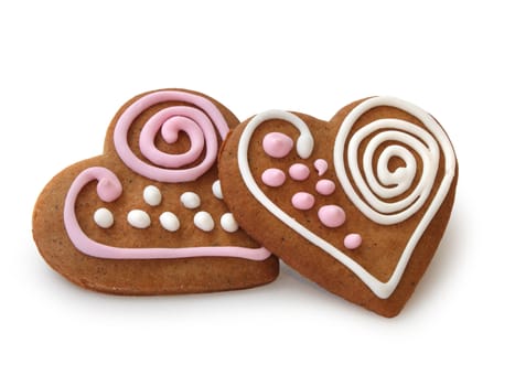 Heart shape ginger breads decorated with pink and white sugar glazing